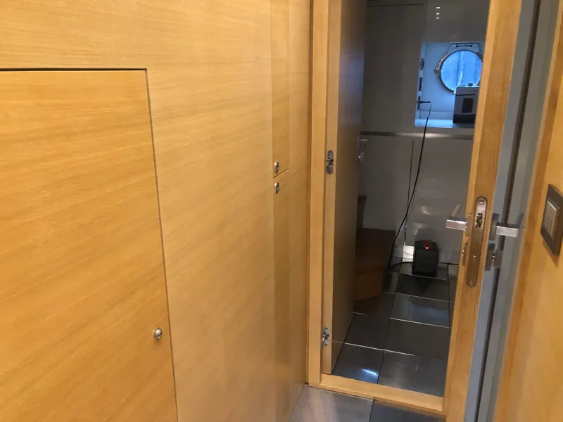 Slide: The Image of Interior hallway of 2012 Monte Carlo Yachts 76, featuring wooden doors and modern design. - 18