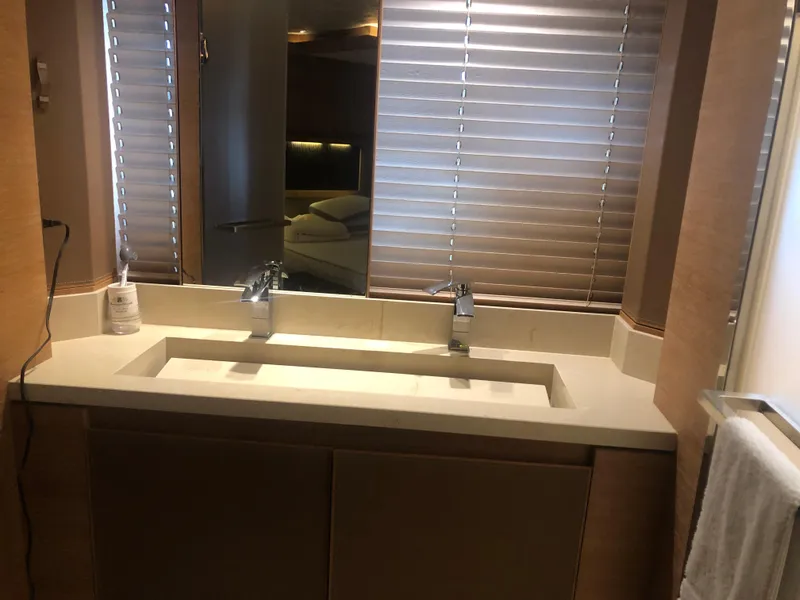 Slide: The Image of Luxury bathroom sink area on 2012 Monte Carlo Yachts 76 with modern fixtures. - 24