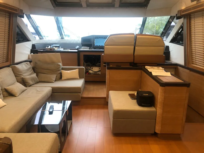 Slide: The Image of Luxurious interior of a 2012 Monte Carlo Yachts 76 with modern furnishings and helm station. - 29