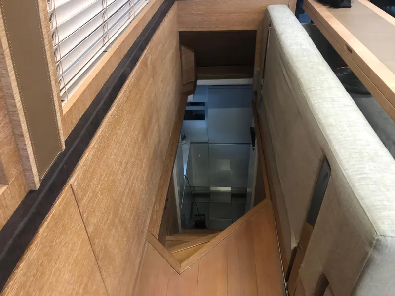 Slide: The Image of Interior stairway of 2012 Monte Carlo Yachts 76, featuring wooden paneling and modern design. - 33