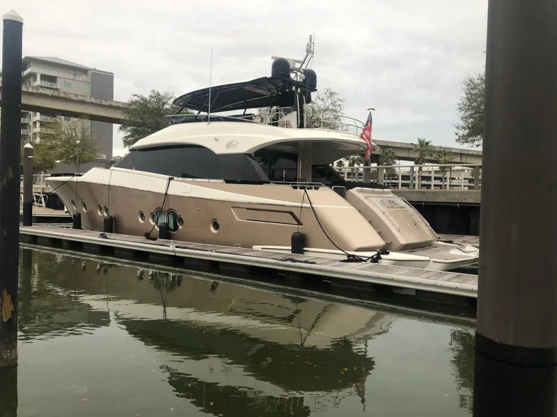 Slide: The Image of 2012 Monte Carlo Yachts 76 docked in a marina. - 7