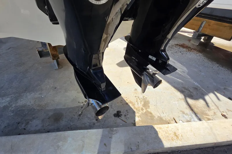 Slide: The Image of 2015 Boston Whaler 270 Vantage outboard motors on a concrete surface. - 18