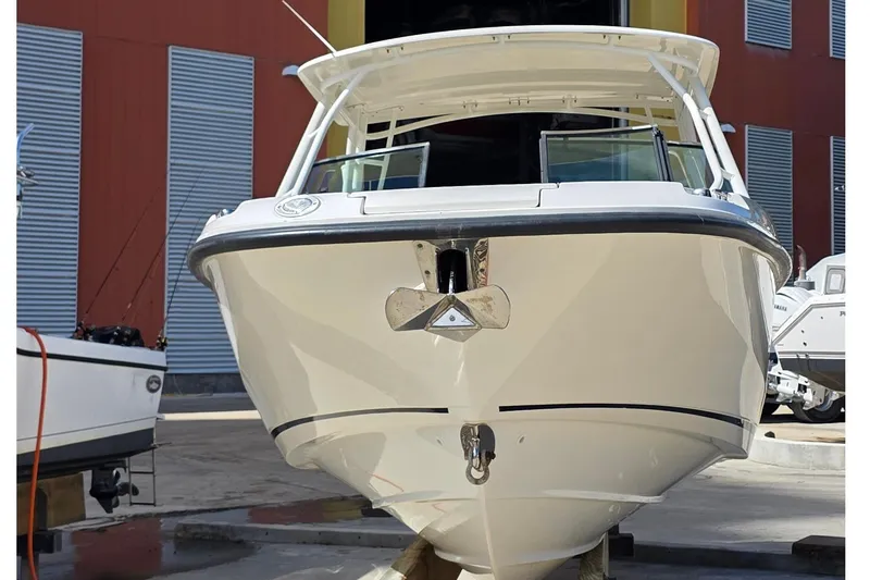 Slide: The Image of 2015 Boston Whaler 270 Vantage in a boatyard. - 28