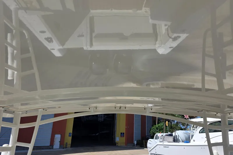 Slide: The Image of 2015 Boston Whaler 270 Vantage boat in a marina, viewed from below. - 33