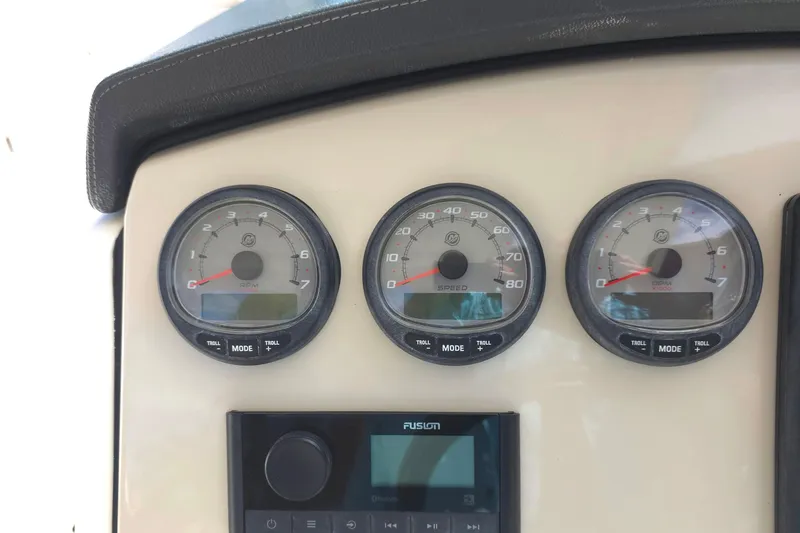 Slide: The Image of Dashboard of a 2015 Boston Whaler 270 Vantage with gauges and Fusion audio system. - 37
