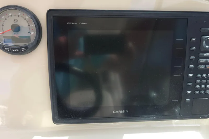 Slide: The Image of Dashboard of a 2015 Boston Whaler 270 Vantage with Garmin GPS and RPM gauge. - 38