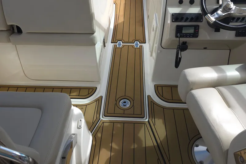 Slide: The Image of Interior view of a 2015 Boston Whaler 270 Vantage boat with teak flooring. - 40