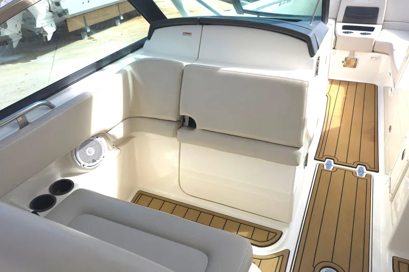 Slide: The Image of Interior of 2015 Boston Whaler 270 Vantage boat with cushioned seating and wood flooring. - 42