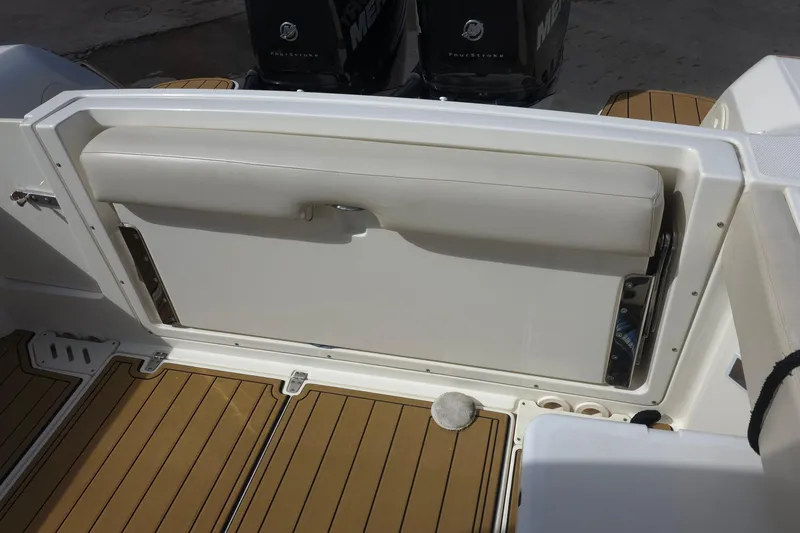 Slide: The Image of 2015 Boston Whaler 270 Vantage boat interior with foldable seat and teak flooring. - 47