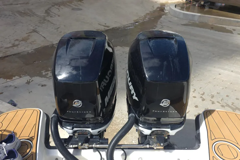 Slide: The Image of Twin Mercury FourStroke engines on a 2015 Boston Whaler 270 Vantage boat. - 49