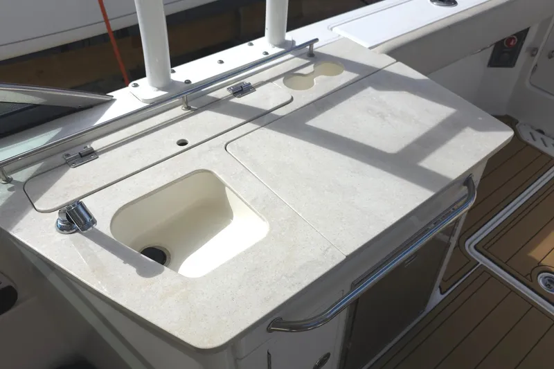 Slide: The Image of 2015 Boston Whaler 270 Vantage boat sink and countertop detail. - 52