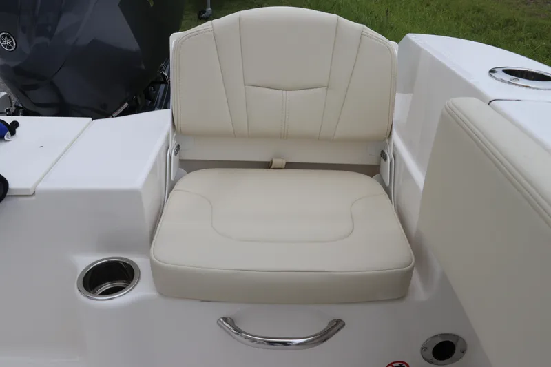 Slide: The Image of 2026 Robalo R200 Center Console boat seat with cup holder and sleek design. - 12