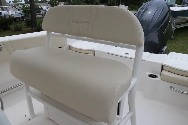 Slide: The Image of 2026 Robalo R200 Center Console boat with beige seating and Yamaha engine. - 15