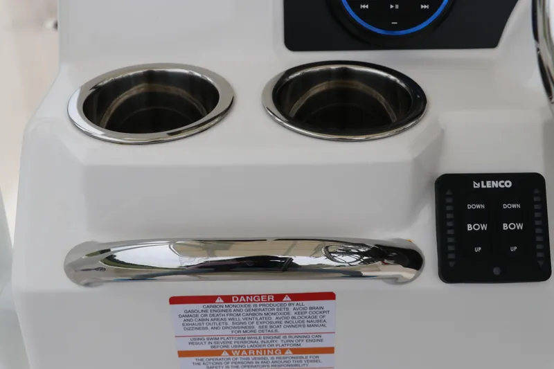 Slide: The Image of 2026 Robalo R200 Center Console boat dashboard with cup holders and control panel. - 18