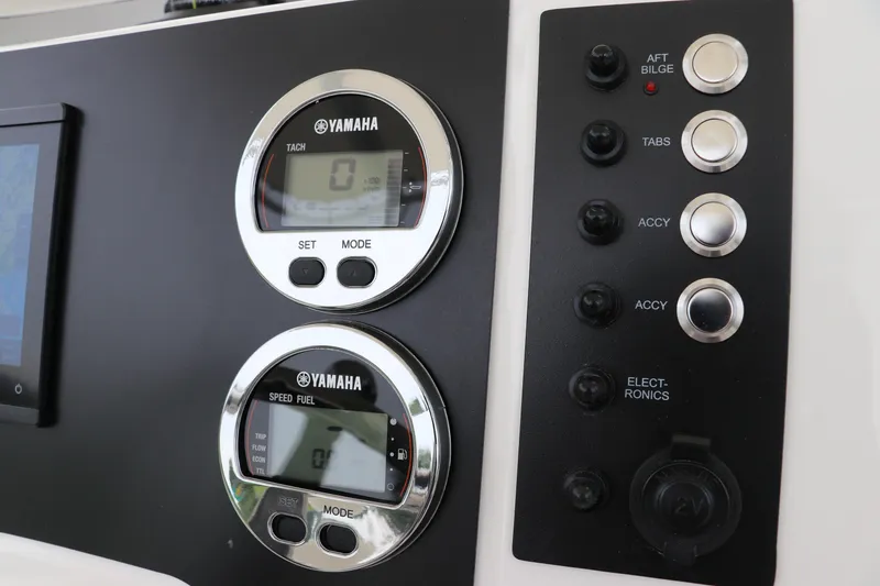 Slide: The Image of 2026 Robalo R200 Center Console dashboard with Yamaha gauges and control switches. - 20