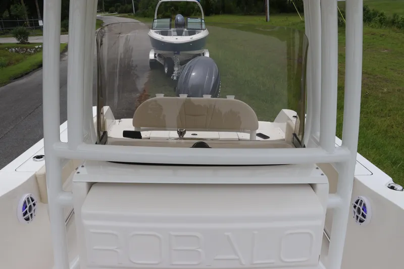 Slide: The Image of 2026 Robalo R200 Center Console boat on a trailer, viewed from the rear. - 21
