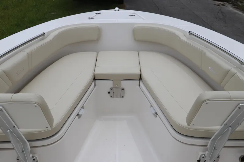 Slide: The Image of 2026 Robalo R200 Center Console boat with spacious seating area and cushioned seats. - 24