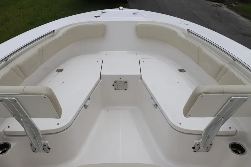 Slide: The Image of 2026 Robalo R200 Center Console boat interior with cushioned seating and storage compartments. - 25