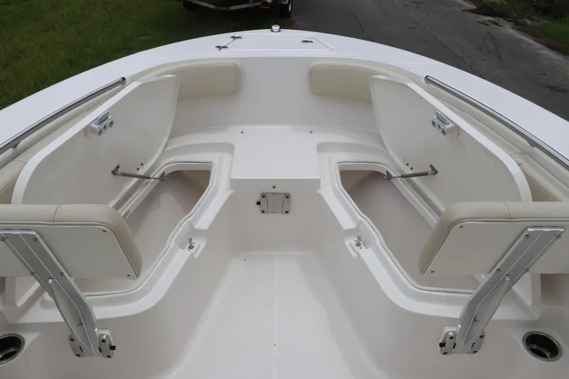 Slide: The Image of 2026 Robalo R200 Center Console boat with open storage compartments. - 26