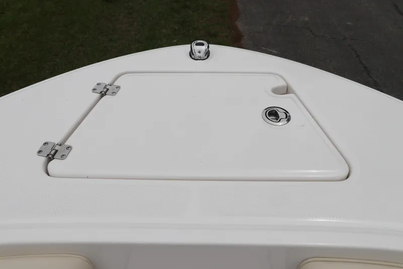 Slide: The Image of 2026 Robalo R200 Center Console boat deck with storage compartment. - 27