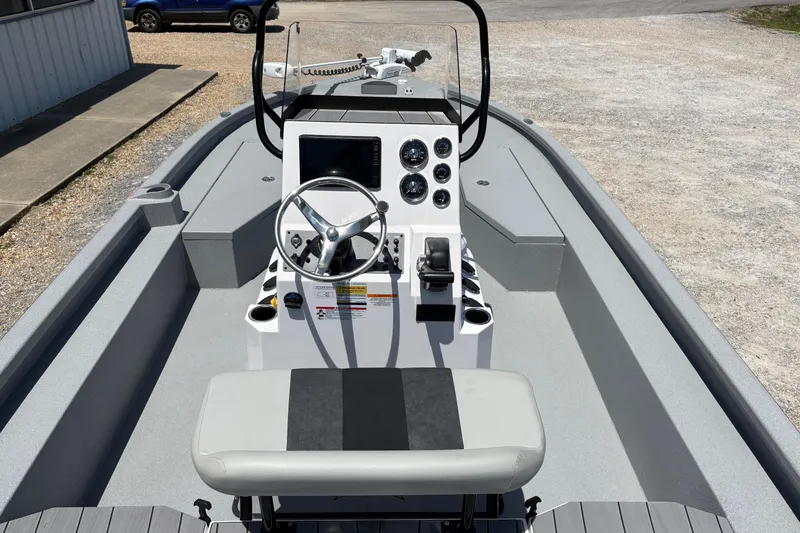 Slide: The Image of 2026 Vexus ACX 2150 boat interior with steering console and seating. - 7