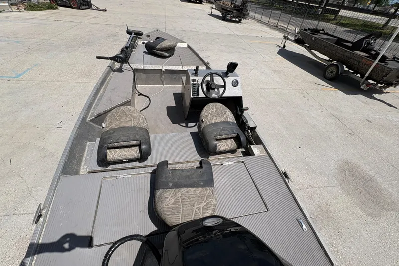 Slide: The Image of 2010 Custom Hanko 16' Side Console boat with camouflage seats and steering wheel. - 13