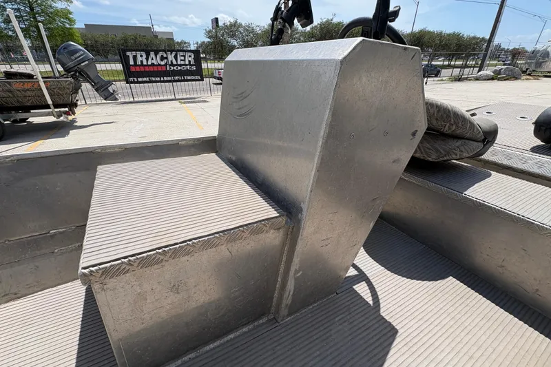 Slide: The Image of Aluminum side console of 2010 Custom Hanko 16' boat in a parking lot. - 17