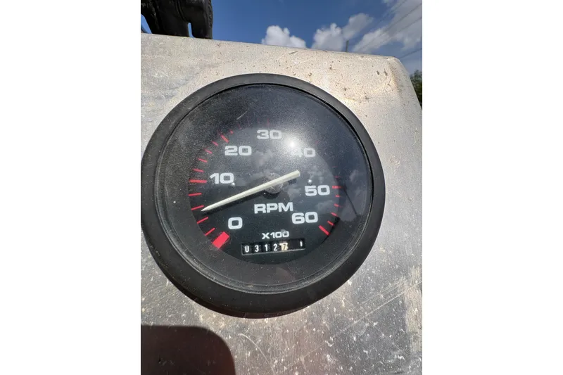 Slide: The Image of Tachometer of 2010 Custom Hanko 16' Side Console showing RPM and odometer reading. - 22
