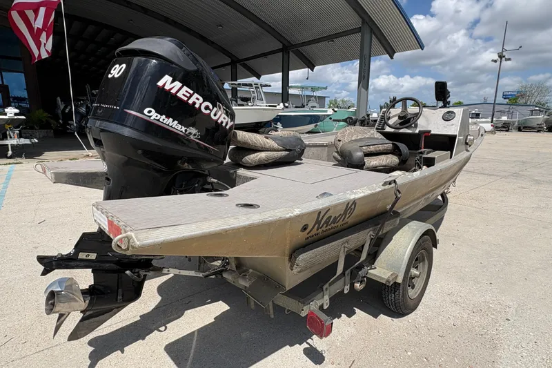 Slide: The Image of 2010 Custom Hanko 16' Side Console boat with Mercury OptiMax engine on trailer. - 4