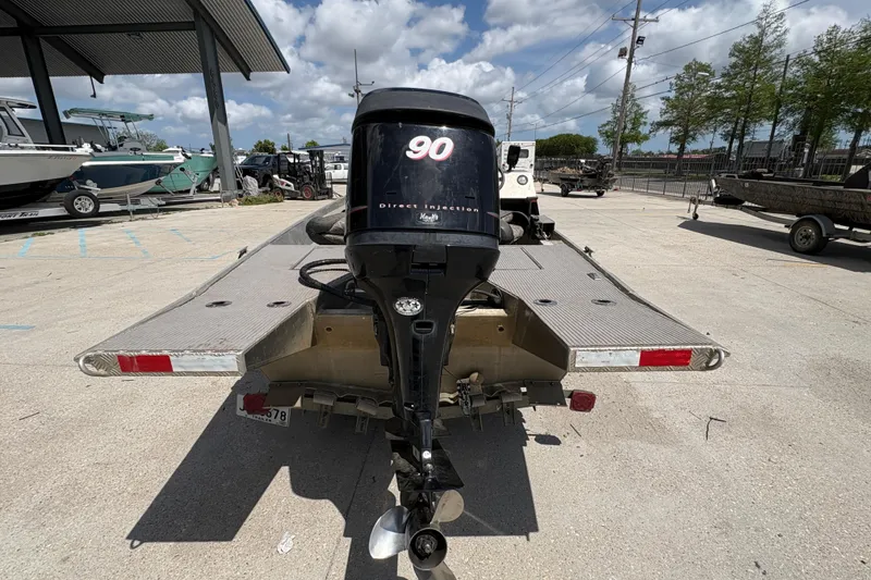 Slide: The Image of Rear view of a 2010 Custom Hanko 16' Side Console boat with outboard motor. - 5