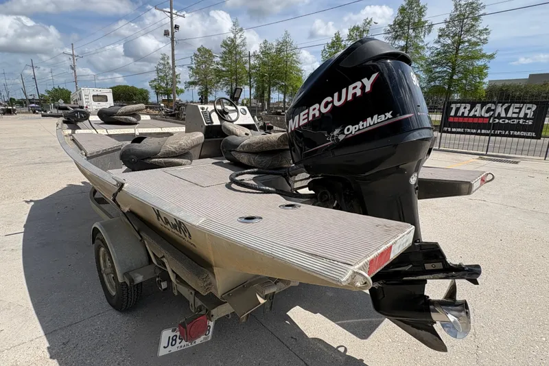 Slide: The Image of Custom 2010 Hanko 16' Side Console boat with Mercury OptiMax engine on trailer. - 6