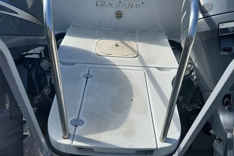 Slide: The Image of 2000 Glacier Bay 2680 Coastal Runner boat deck with stainless steel rails. - 10