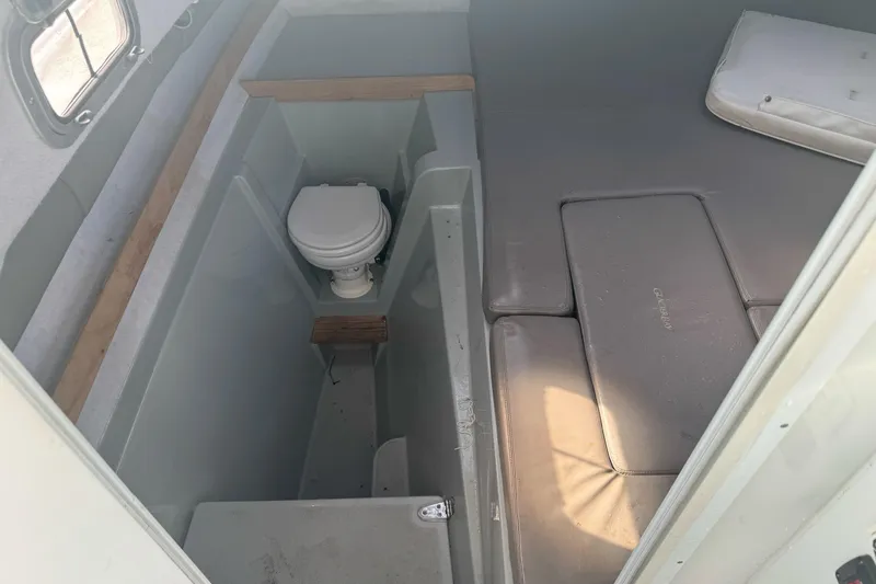 Slide: The Image of Interior of 2000 Glacier Bay 2680 Coastal Runner with toilet and seating area. - 20