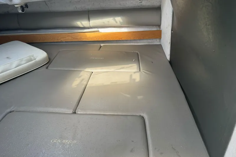 Slide: The Image of Interior cabin of 2000 Glacier Bay 2680 Coastal Runner with cushioned seating. - 23