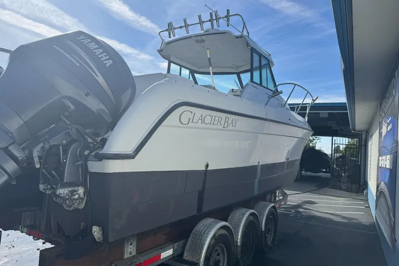 Slide: The Image of 2000 Glacier Bay 2680 Coastal Runner boat on trailer with Yamaha outboard motor. - 8