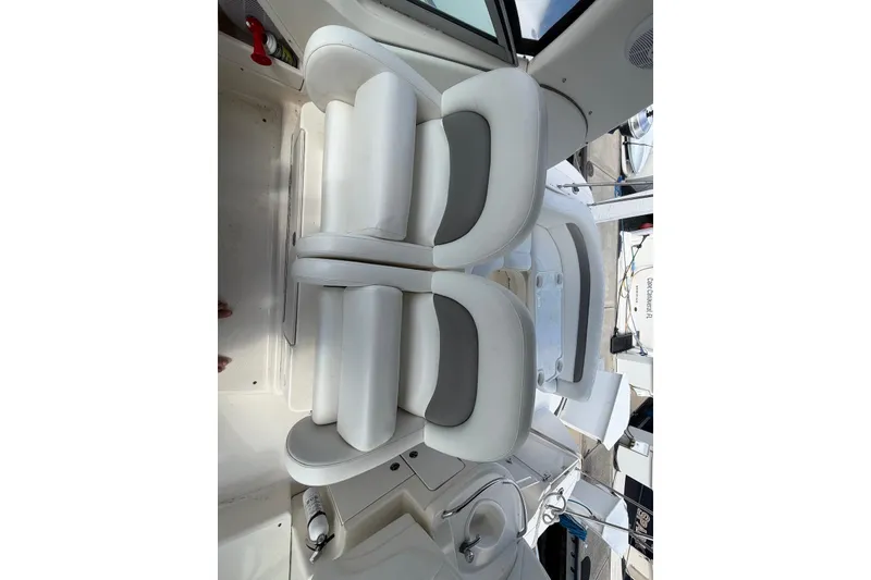 Slide: The Image of Interior of a 2003 Sea Ray 340 Sundancer boat with white seating. - 10
