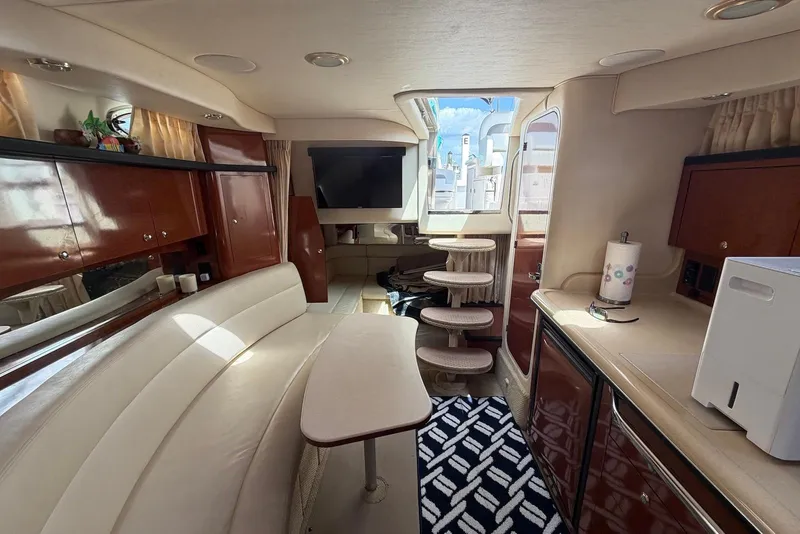 Slide: The Image of Luxurious interior of a 2003 Sea Ray 340 Sundancer yacht with elegant seating and cabinetry. - 16
