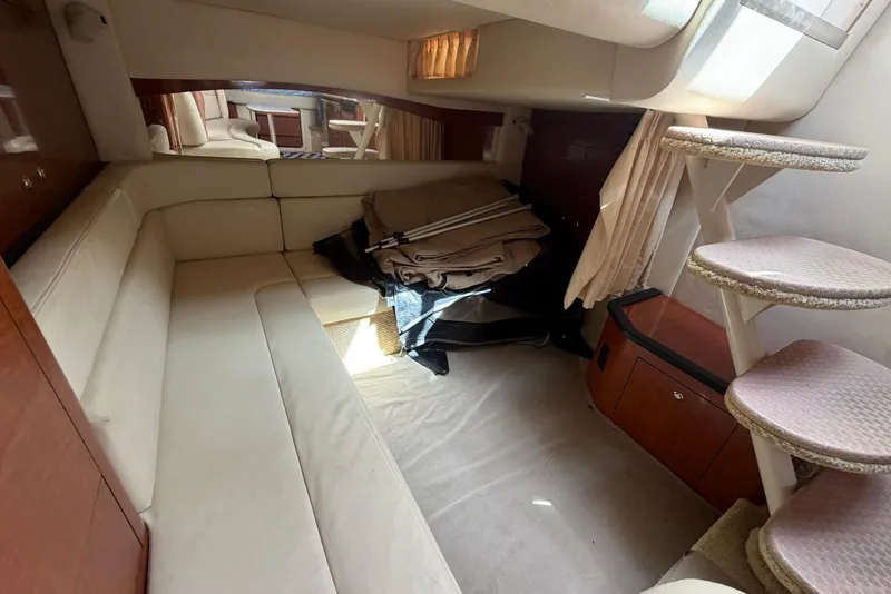 Slide: The Image of Interior cabin of 2003 Sea Ray 340 Sundancer with beige seating and carpeted stairs. - 20