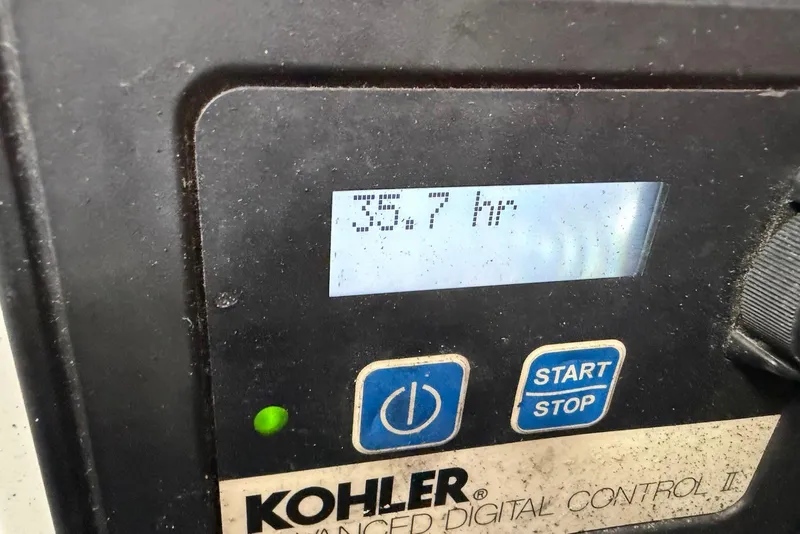 Slide: The Image of Kohler generator control panel showing 35.7 hours on a 2003 Sea Ray 340 Sundancer. - 23