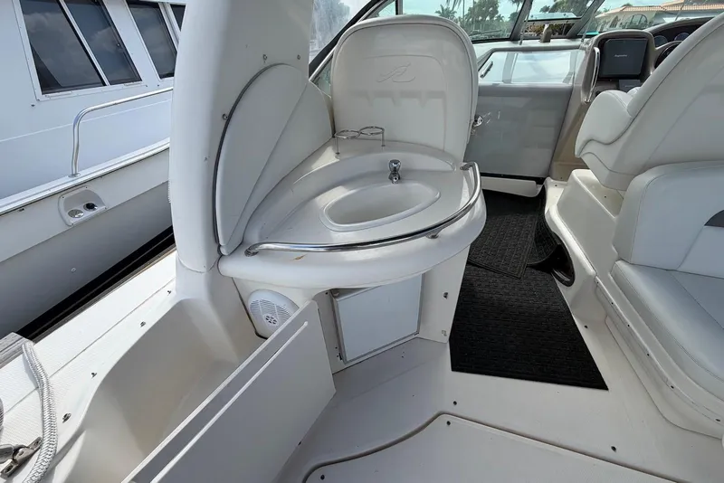 Slide: The Image of 2003 Sea Ray 340 Sundancer interior with sink and seating area. - 7