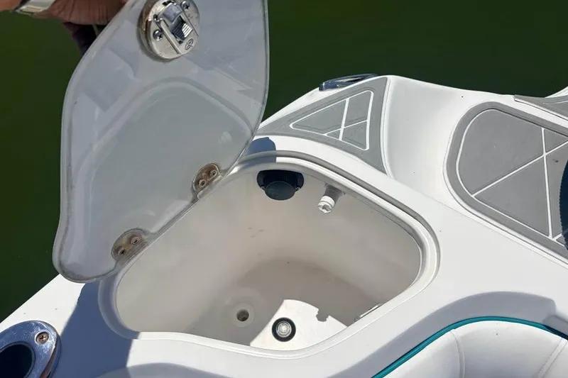 Slide: The Image of Open storage compartment on 2018 Glasstream 280 Pro-XS boat, showing interior details. - 11