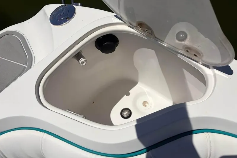 Slide: The Image of Open storage compartment on a 2018 Glasstream 280 Pro-XS boat, featuring a sleek design. - 12