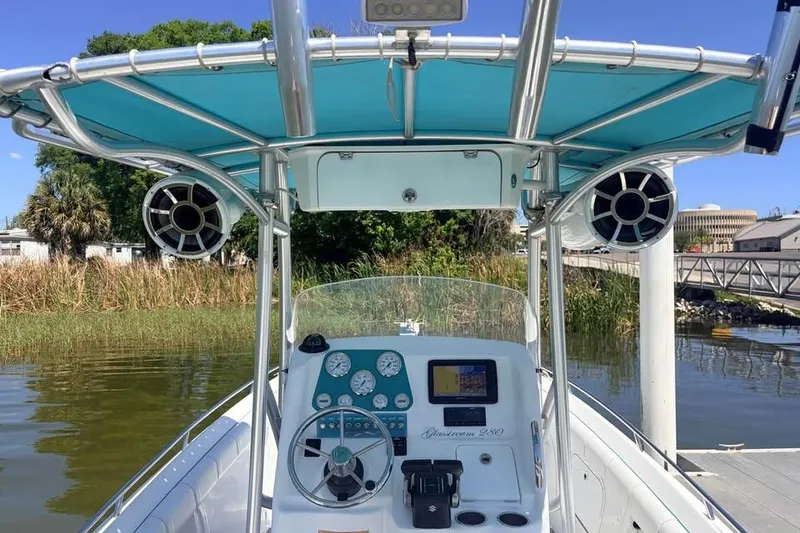 Slide: The Image of 2018 Glasstream 280 Pro-XS boat dashboard with blue canopy and speakers. - 13