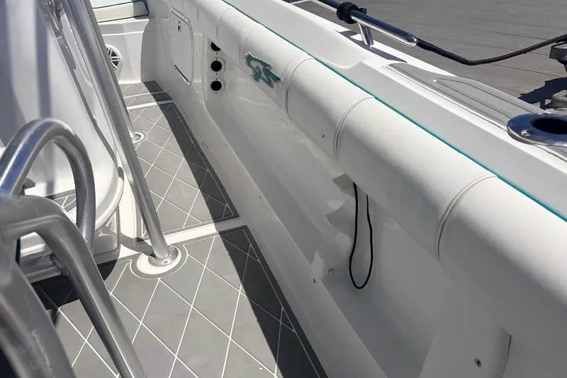 Slide: The Image of 2018 Glasstream 280 Pro-XS boat interior with sleek white seating and modern flooring. - 17