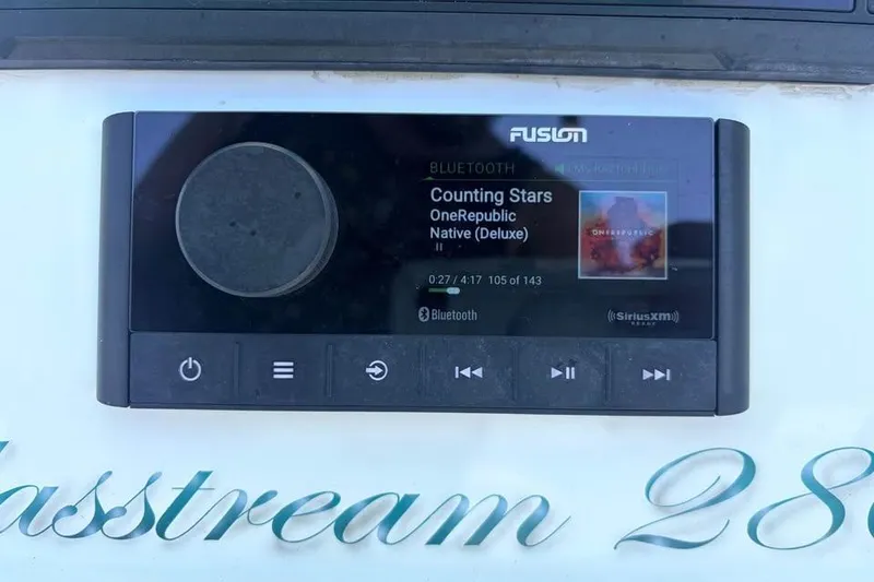 Slide: The Image of Fusion stereo system on a 2018 Glasstream 280 Pro-XS, playing "Counting Stars" by OneRepublic. - 3
