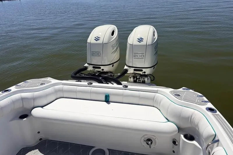 Slide: The Image of 2018 Glasstream 280 Pro-XS boat with twin Suzuki 200 outboard engines on water. - 9