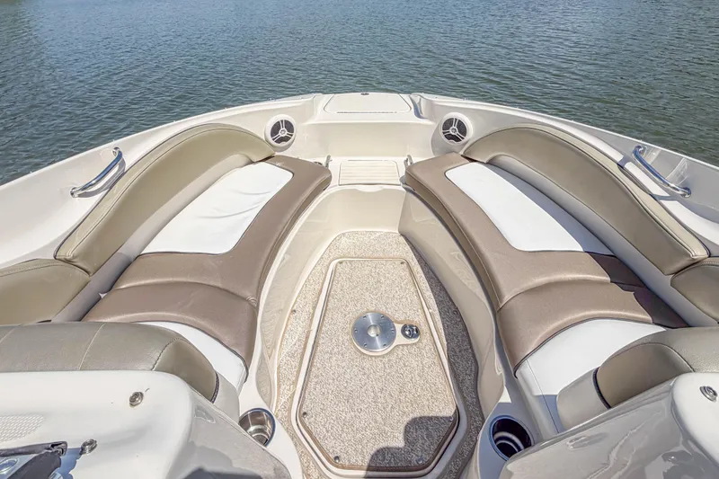 Slide: The Image of 2007 Sea Ray 220 Sundeck interior with cushioned seating and water view. - 11
