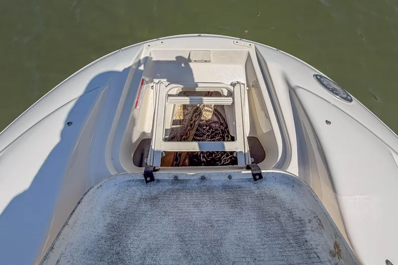 Slide: The Image of Bow view of 2007 Sea Ray 220 Sundeck with anchor storage compartment open. - 12