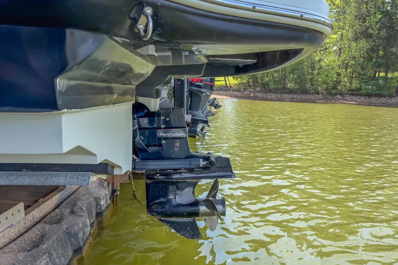 Slide: The Image of Rear view of a 2007 Sea Ray 220 Sundeck boat with MerCruiser engines in water. - 20