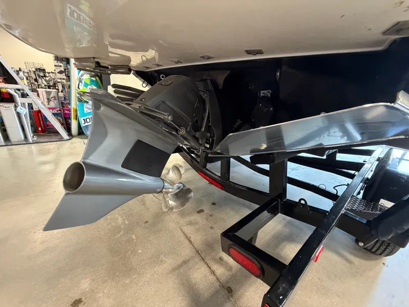 Slide: The Image of Rear view of a 2022 Regal LS4 Surf boat on a trailer. - 17